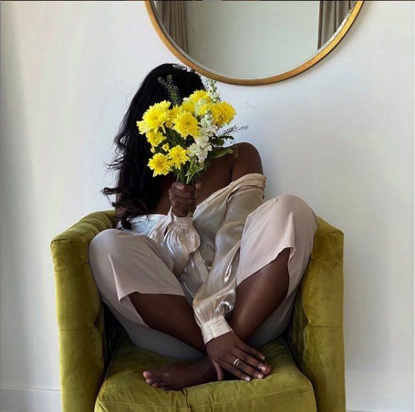 Happy lady holding a flower bouquet